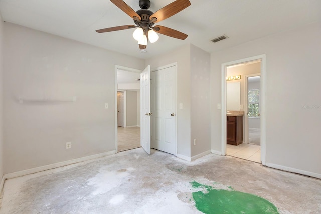 2320 Red Ember Rd, Oviedo, FL 32765 - unfurnished bedroom with baseboards, ensuite bathroom, unfinished concrete flooring, and a ceiling fan