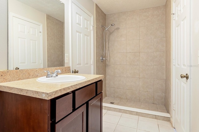 2320 Red Ember Rd, Oviedo, FL 32765 - full bath featuring vanity, a tile shower, and tile patterned floors
