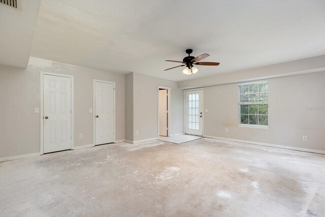 2320 Red Ember Rd, Oviedo, FL 32765 - empty room with ceiling fan, baseboards, and concrete floors