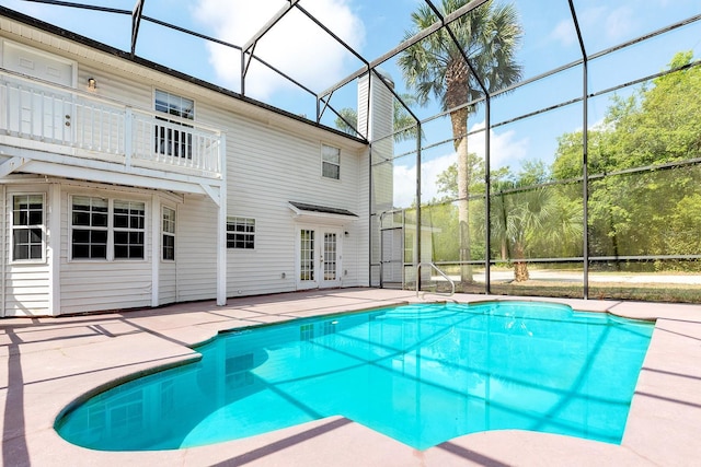 2320 Red Ember Rd, Oviedo, FL 32765 - outdoor pool with french doors, a patio, and a lanai