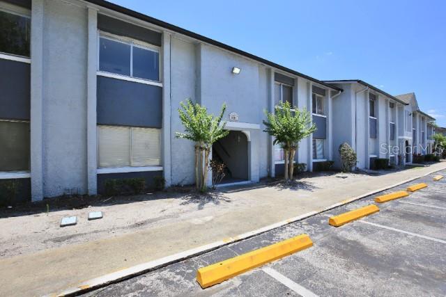 view of property with uncovered parking