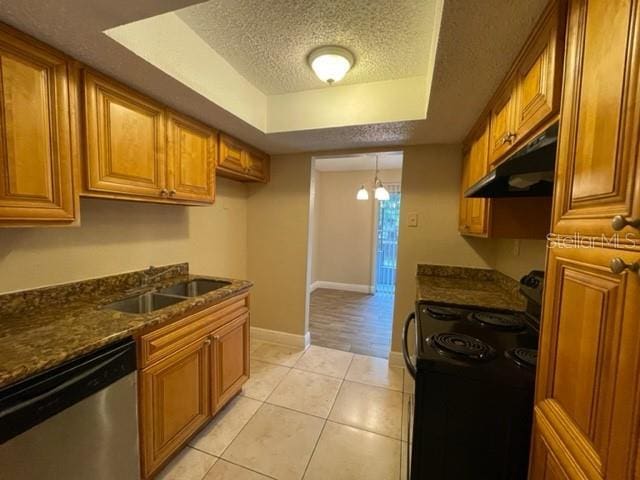 kitchen featuring black range with electric cooktop, brown cabinetry, a textured ceiling, under cabinet range hood, and dishwasher