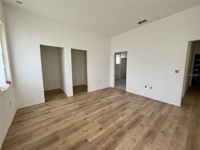 unfurnished bedroom featuring light wood finished floors