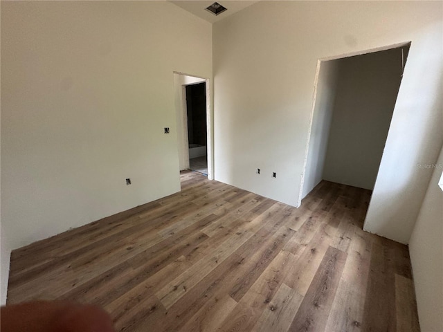 unfurnished room with light wood-type flooring