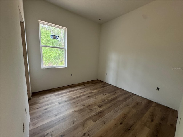 empty room featuring wood finished floors