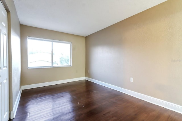4727 S Texas Ave Unit 4727C, Orlando, FL 32839 - empty room with baseboards and dark wood-type flooring