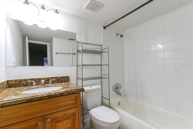 4727 S Texas Ave Unit 4727C, Orlando, FL 32839 - full bathroom with a textured ceiling, toilet, visible vents, vanity, and bathtub / shower combination