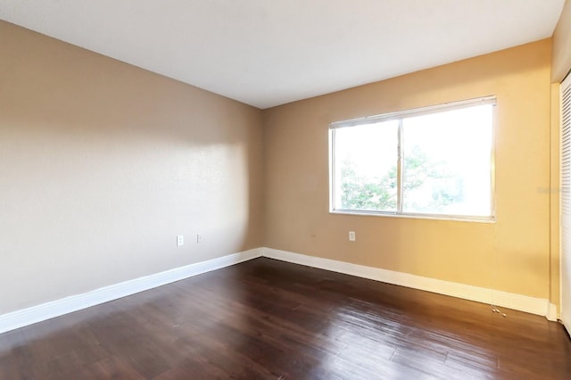 4727 S Texas Ave Unit 4727C, Orlando, FL 32839 - spare room featuring baseboards and dark wood-style flooring