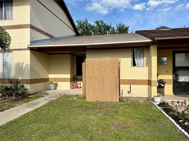 963 Stucki Ter, Winter Garden, FL 34787 - view of home's exterior with stucco siding and a lawn