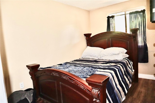 963 Stucki Ter, Winter Garden, FL 34787 - bedroom featuring baseboards and wood finished floors
