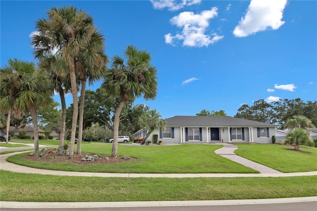 ranch-style home with a front lawn