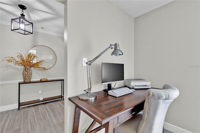 office area with baseboards and ornamental molding