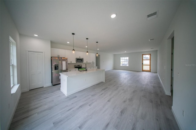 kitchen featuring recessed lighting, baseboards, visible vents, white cabinets, and appliances with stainless steel finishes
