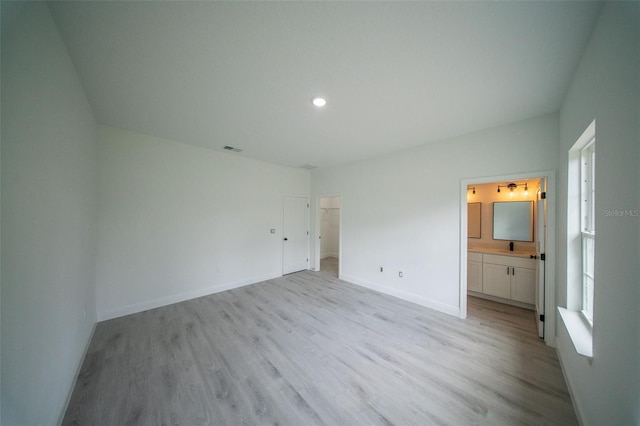 unfurnished bedroom featuring visible vents, light wood-style flooring, baseboards, and recessed lighting
