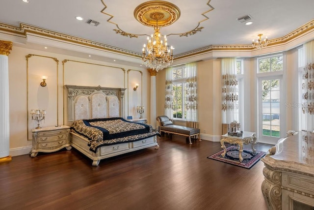 bedroom featuring a chandelier, wood finished floors, baseboards, ornamental molding, and recessed lighting