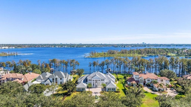 aerial view of residential area featuring a large body of water