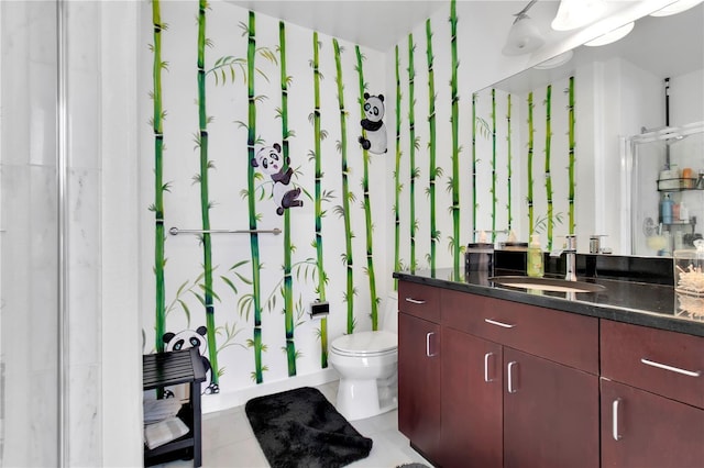150 E Robinson St Unit 2002, Orlando, FL 32801 - bathroom featuring vanity, toilet, tile patterned flooring, and an enclosed shower