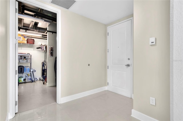 150 E Robinson St Unit 2002, Orlando, FL 32801 - hallway with baseboards and light tile patterned flooring