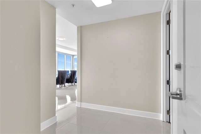 150 E Robinson St Unit 2002, Orlando, FL 32801 - hallway featuring baseboards and light tile patterned floors