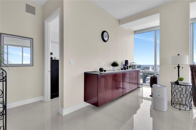 150 E Robinson St Unit 2002, Orlando, FL 32801 - bar area featuring light tile patterned flooring and baseboards