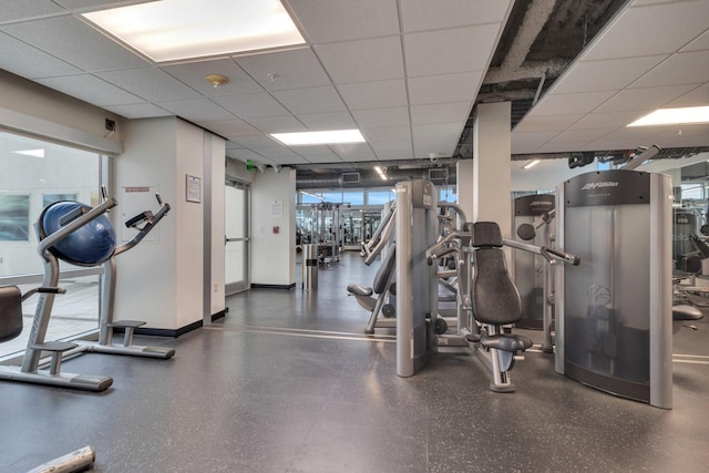 150 E Robinson St Unit 2002, Orlando, FL 32801 - exercise room with a paneled ceiling and baseboards