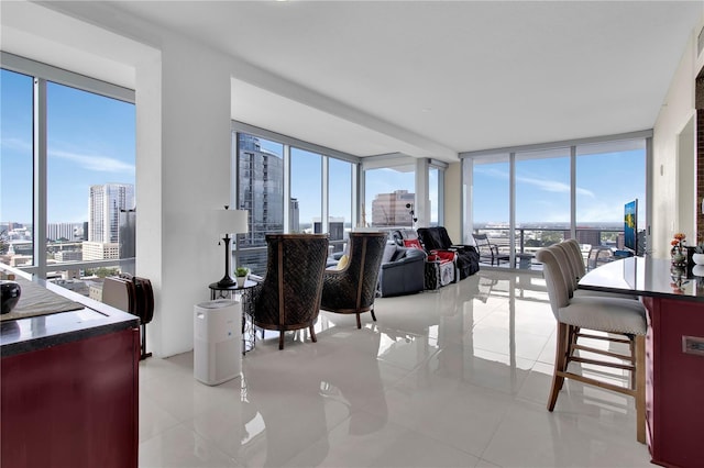150 E Robinson St Unit 2002, Orlando, FL 32801 - living room with a city view, light tile patterned floors, healthy amount of natural light, and expansive windows
