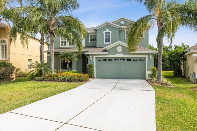 2842 Balforn Tower, Winter Garden, FL 34787 - mediterranean / spanish home with concrete driveway, stucco siding, and a front lawn