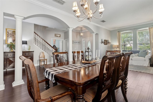 2842 Balforn Tower, Winter Garden, FL 34787 - dining area featuring hardwood / wood-style flooring, arched walkways, visible vents, and decorative columns