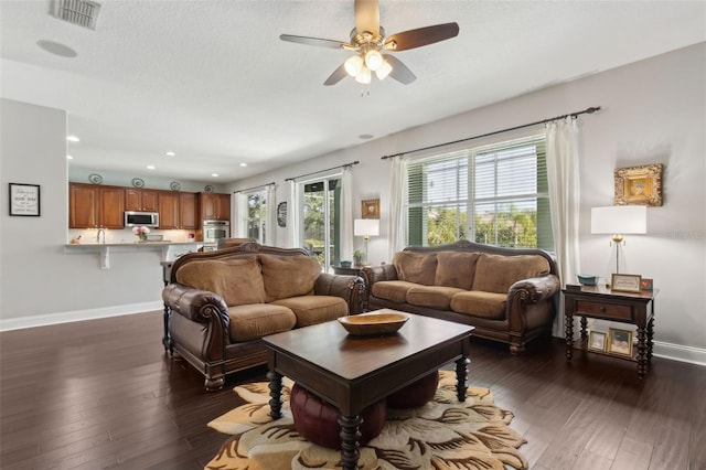 2842 Balforn Tower, Winter Garden, FL 34787 - living room featuring recessed lighting, baseboards, dark wood-style flooring, ceiling fan, and visible vents