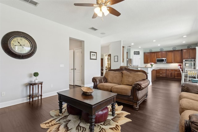 2842 Balforn Tower, Winter Garden, FL 34787 - living room featuring visible vents, baseboards, a ceiling fan, and dark wood-style floors