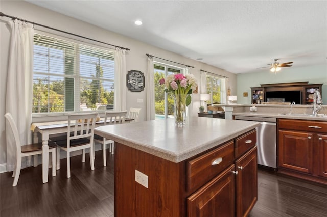 2842 Balforn Tower, Winter Garden, FL 34787 - kitchen featuring a center island, dishwasher, a sink, open floor plan, and light countertops