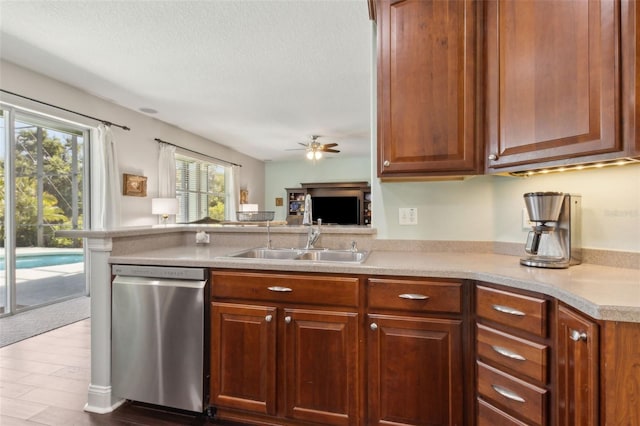 2842 Balforn Tower, Winter Garden, FL 34787 - kitchen with a sink, a peninsula, light countertops, a ceiling fan, and stainless steel dishwasher