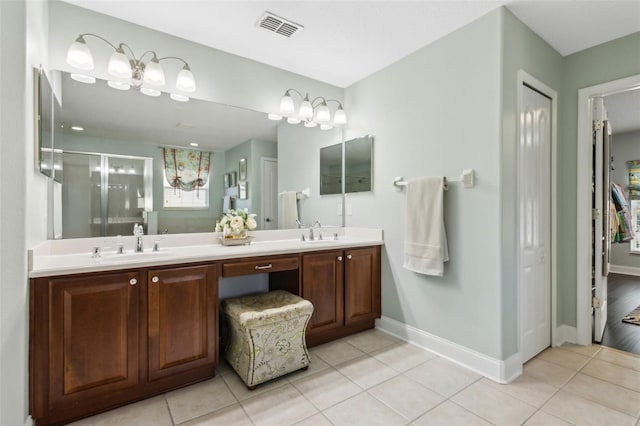 2842 Balforn Tower, Winter Garden, FL 34787 - bathroom featuring baseboards, visible vents, a shower stall, tile patterned floors, and double vanity