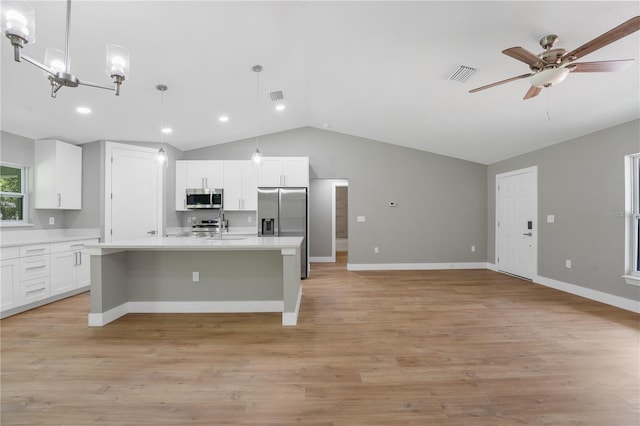 274 W Bolero Pl, Citrus Springs, FL 34434 - kitchen with appliances with stainless steel finishes, vaulted ceiling, light countertops, a ceiling fan, and white cabinets