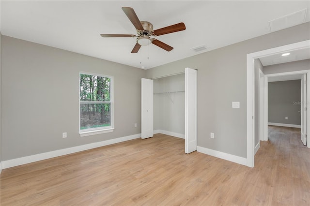 274 W Bolero Pl, Citrus Springs, FL 34434 - unfurnished bedroom with baseboards, light wood finished floors, and a closet