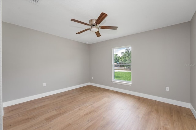 274 W Bolero Pl, Citrus Springs, FL 34434 - unfurnished room with baseboards, light wood finished floors, and a ceiling fan