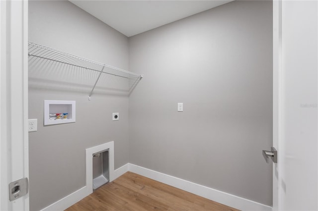 274 W Bolero Pl, Citrus Springs, FL 34434 - washroom with hookup for a washing machine, hookup for an electric dryer, light wood-style floors, and baseboards