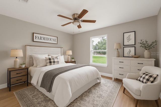 274 W Bolero Pl, Citrus Springs, FL 34434 - bedroom featuring light wood-style flooring and ceiling fan