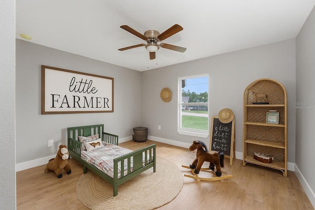 274 W Bolero Pl, Citrus Springs, FL 34434 - bedroom with wood finished floors and a ceiling fan