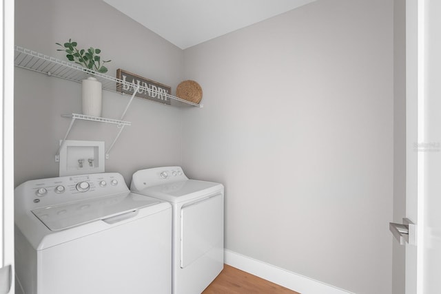 274 W Bolero Pl, Citrus Springs, FL 34434 - laundry area featuring washer and dryer and light wood-type flooring