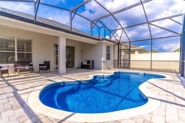 view of pool with fence, a patio, a fenced in pool, and an outdoor living space