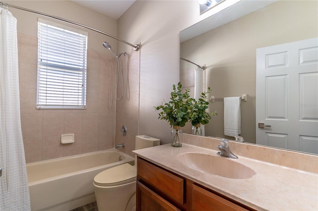 full bath featuring toilet, vanity, and shower / bath combo with shower curtain