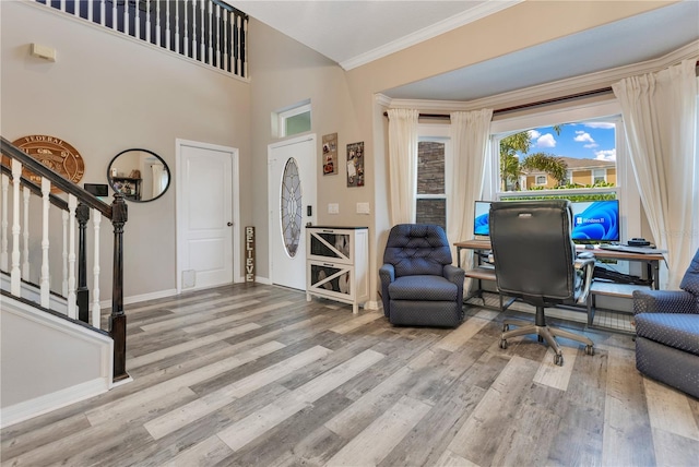 entrance foyer featuring crown molding, stairs, baseboards, and wood finished floors