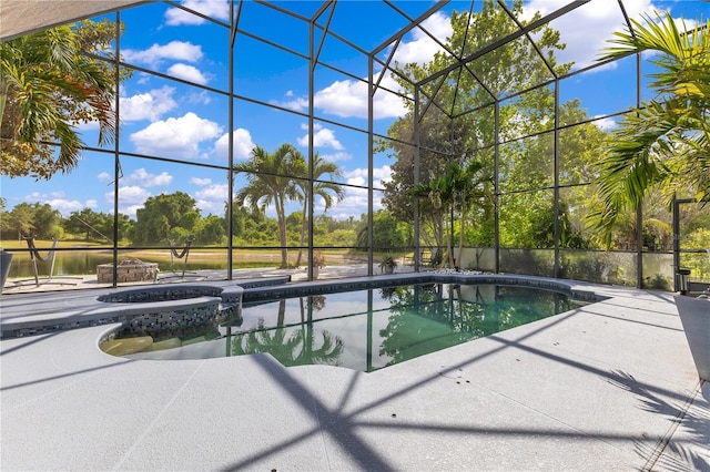 view of pool featuring a water view, a patio, and a lanai