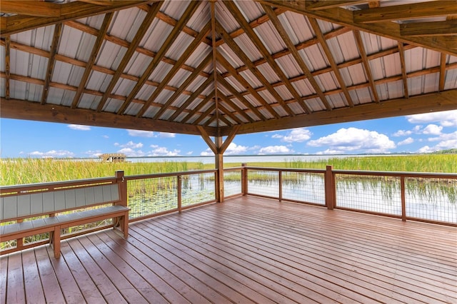 wooden deck with a water view and a gazebo