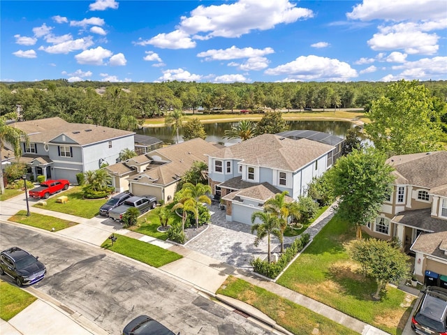 birds eye view of property featuring a water view and a residential view