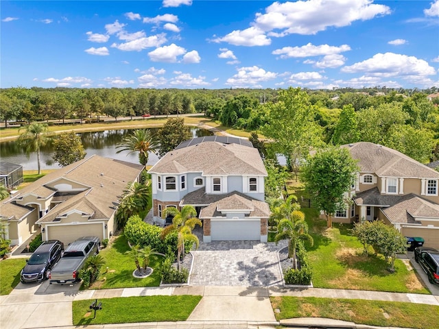 birds eye view of property featuring a water view and a residential view