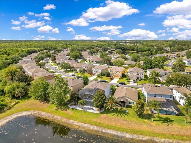 drone / aerial view featuring a water view and a residential view