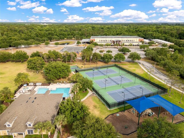 aerial view featuring a wooded view