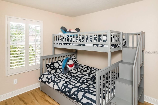 3643 Calabria Ave, Davenport, FL 33897 - bedroom with baseboards and wood finished floors